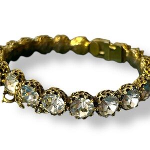VINTAGE Signed Jeanne Clear RHINESTONE Antiqued Goldtone Clamper BANGLE BRACELET
